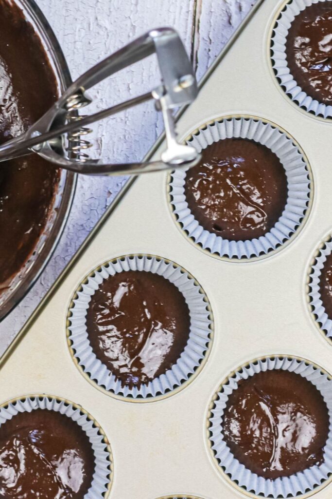 chocolate cupcake batter in muffin tin 