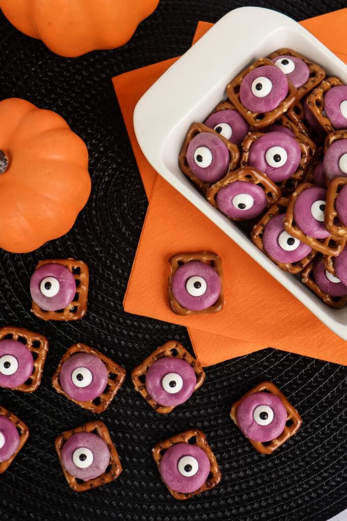 halloween chocolate covered pretzels on a table 