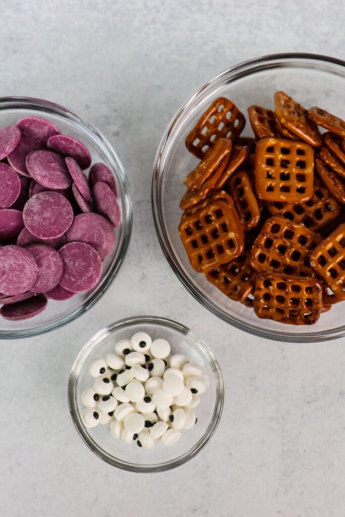 ingredients for pretzel monsters on cookie sheet