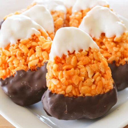 rice crispy treats shaped like candy corn on platter