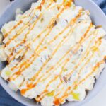 caramel snicker salad in a bowl on table