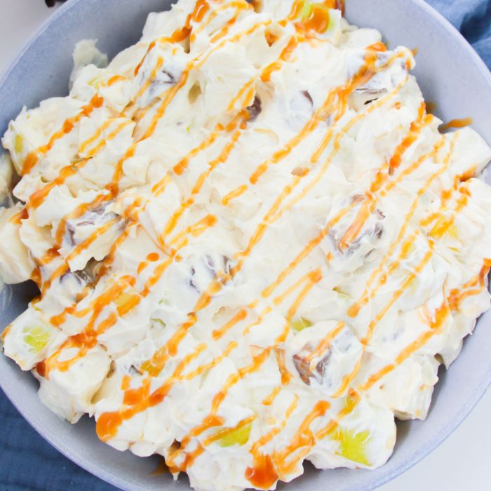 caramel snicker salad in a bowl on table 