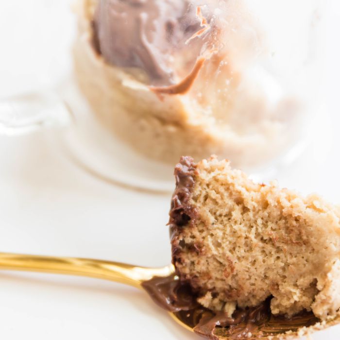 spoon with cake and hazelut spread on it 