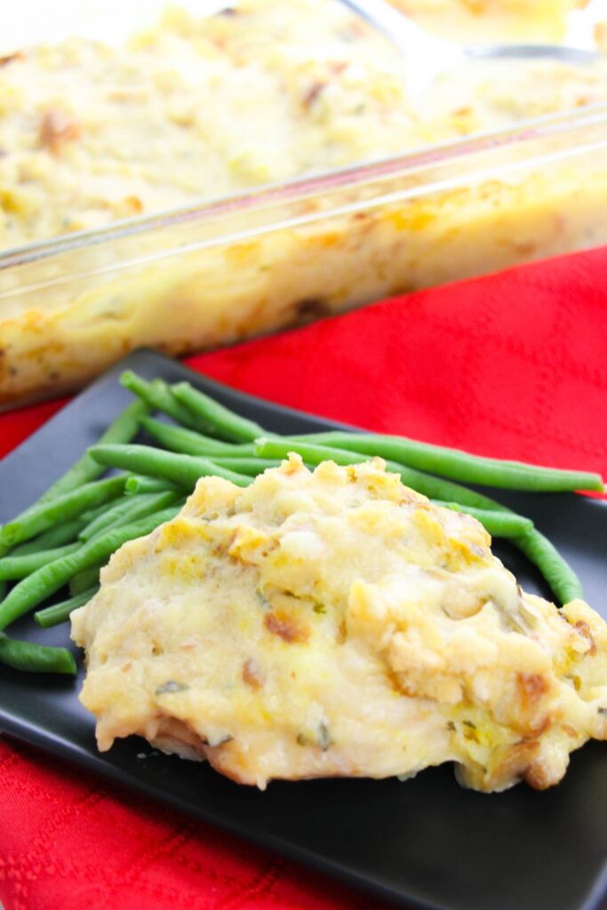 creamy chicken bake on plate with green beans 