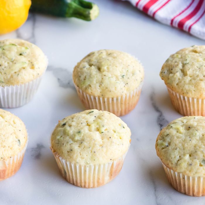 lemon zucchini muffins on marble counter 