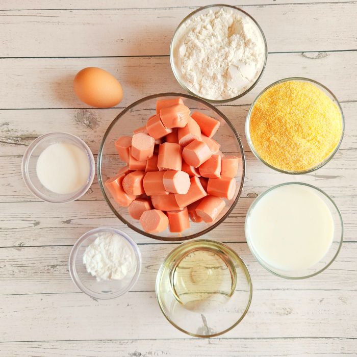 ingredients for corn dog cups on a wooden counter 