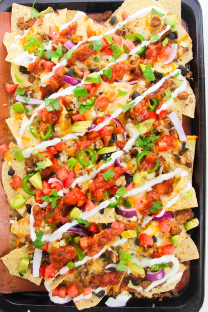 nachos with cheese on a table