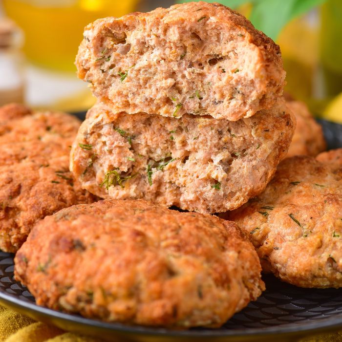 plate with salmon cakes and one broken in half and placed on plate