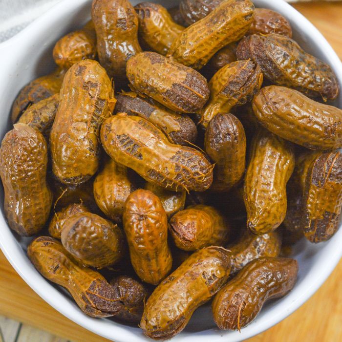 boiled peanuts in a white bowl on the counter 