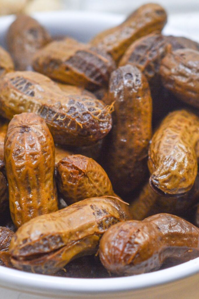 close up of boiled peanuts in a bowl on table 