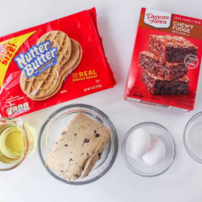 ingredients for layered brownies on a white table 