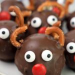 close up of reindeer designed no bake balls on plate