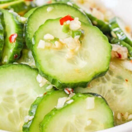 close up of white bowl with Korean cucumbers