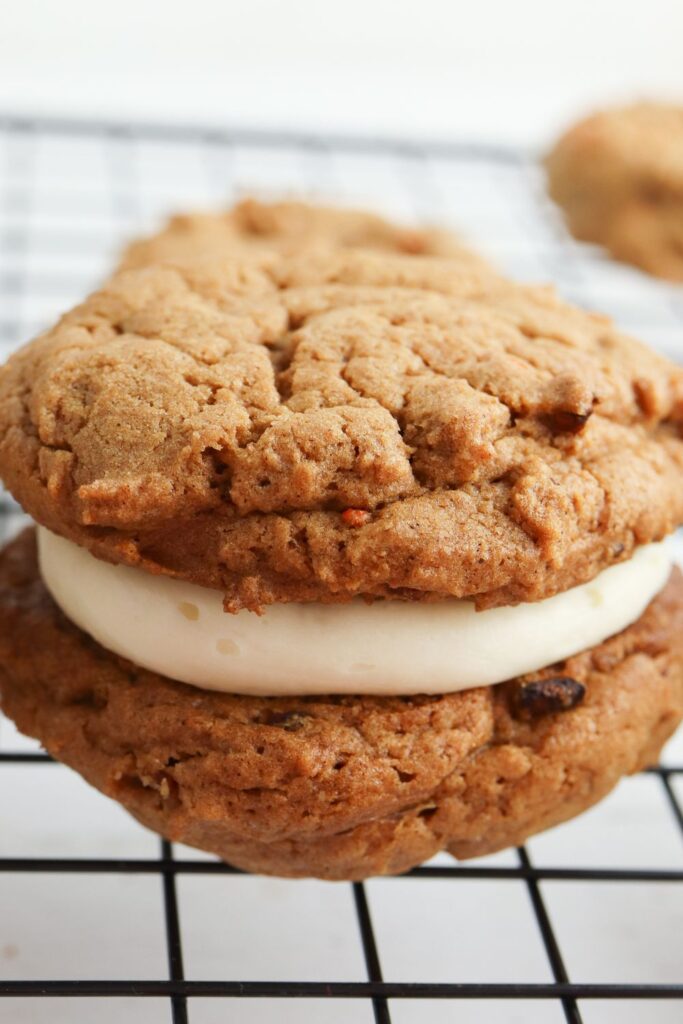 close up of sandwich cookie on metal cooling rack