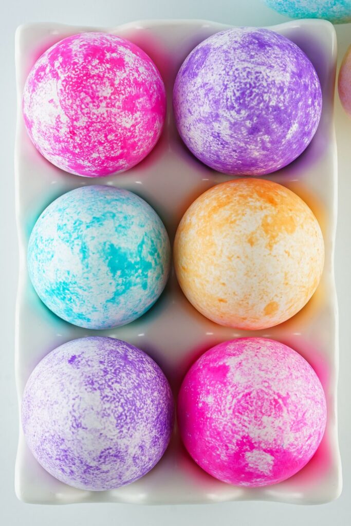 eggs in a carton that are colored