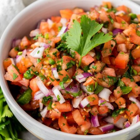 homemade salsa in a bowl garnished with cilantro