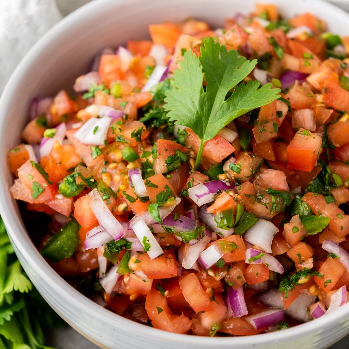 homemade salsa in a bowl garnished with cilantro 