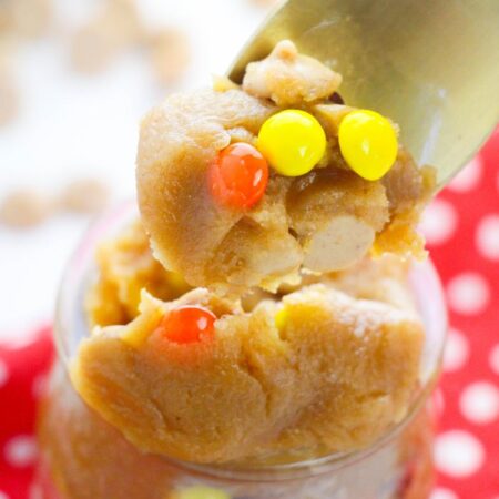 peanut butter cookie dough in a bowl with a spoonful on top