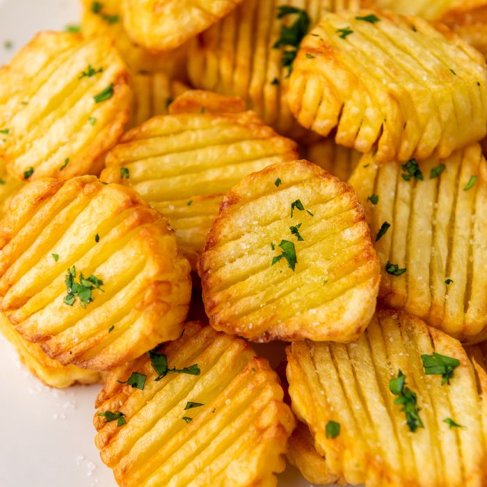 plate with accordian potatoes and garnish on top