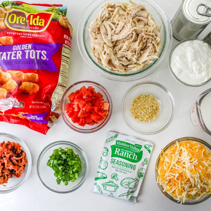 ingredients for a chicken tater tot casserole on white counter 