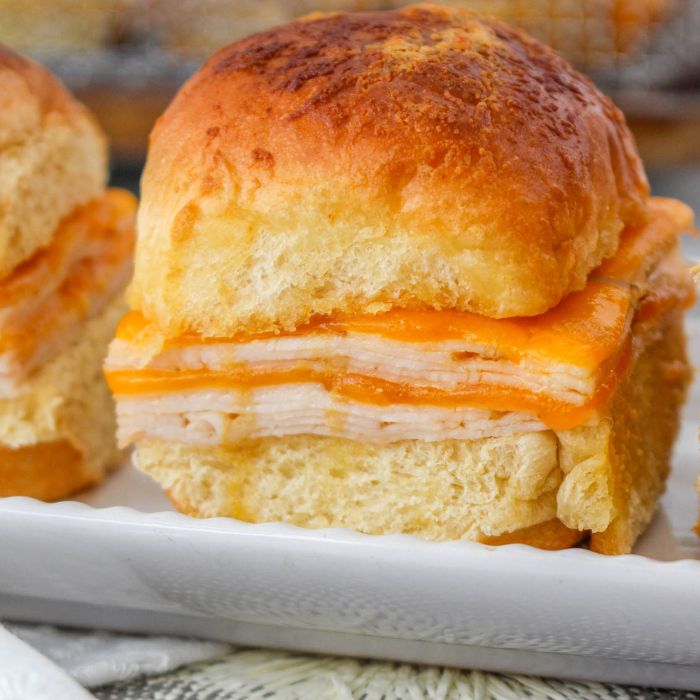 sliders on a tray sitting on table 