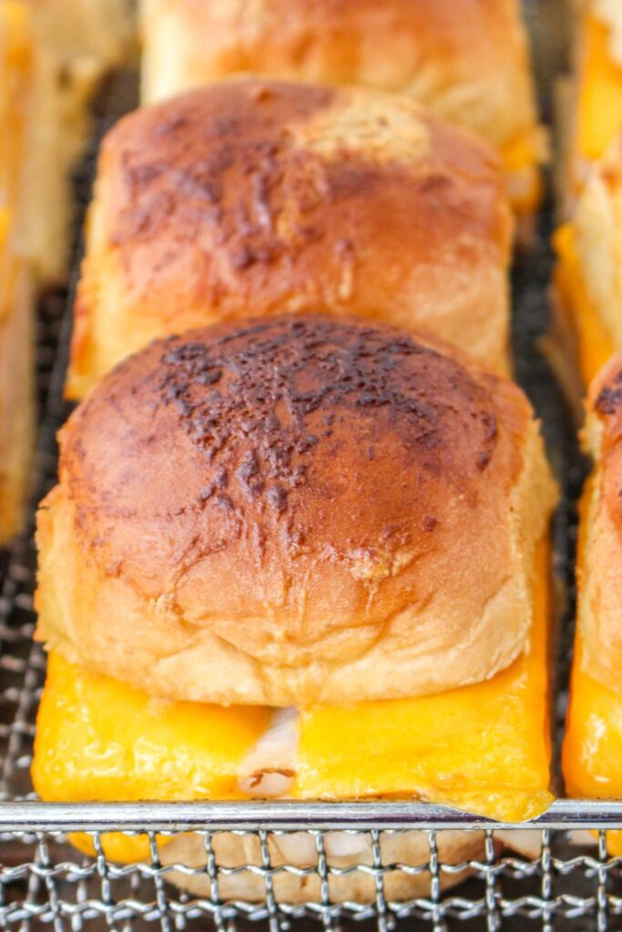 turkey and cheese sliders cooked and sitting on a baking tray