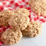 Peanut Butter No Bake Cookies stacked on table with a napkin by it