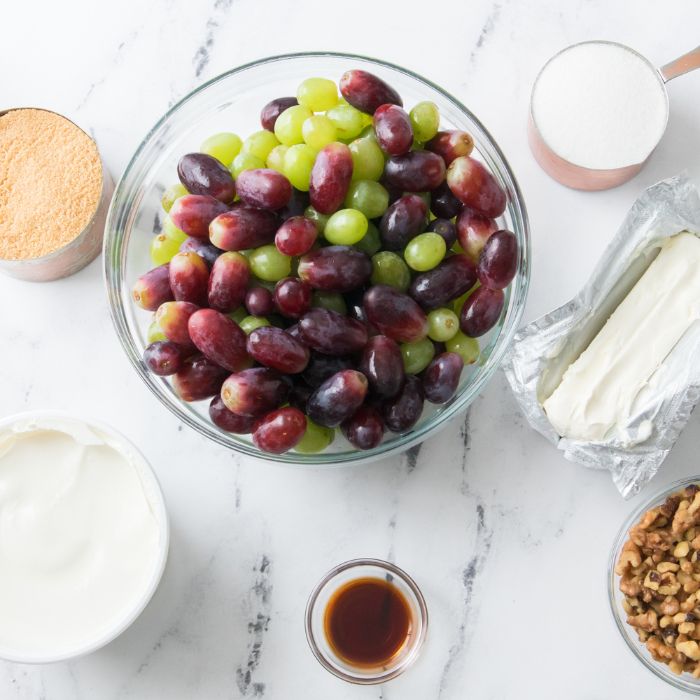 ingredients for grape salad on marble counter 