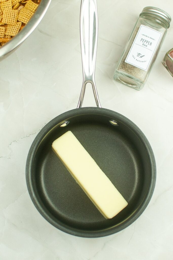 stick of butter in a pan 