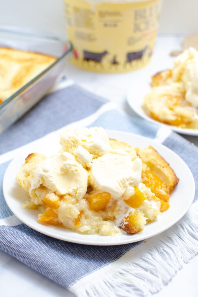 cobbler on plate with ice cream on top