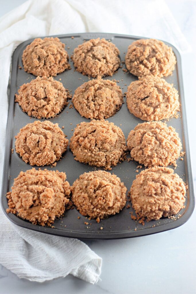 apple muffins on table in a muffin tin 