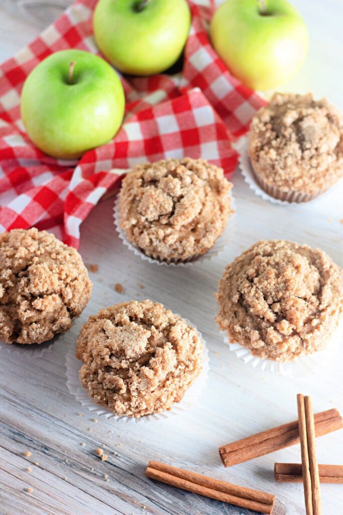 overhead camera shot of apple cinnamon muffins on table 