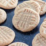 peanut butter cookies on a black speckled tray on table