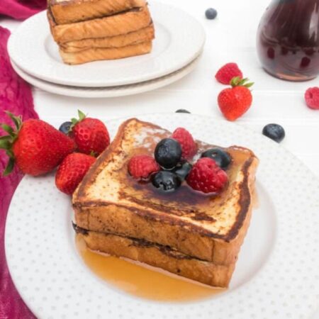 white plate with stack of french toast
