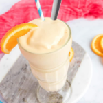 clear cup with an orange shake
