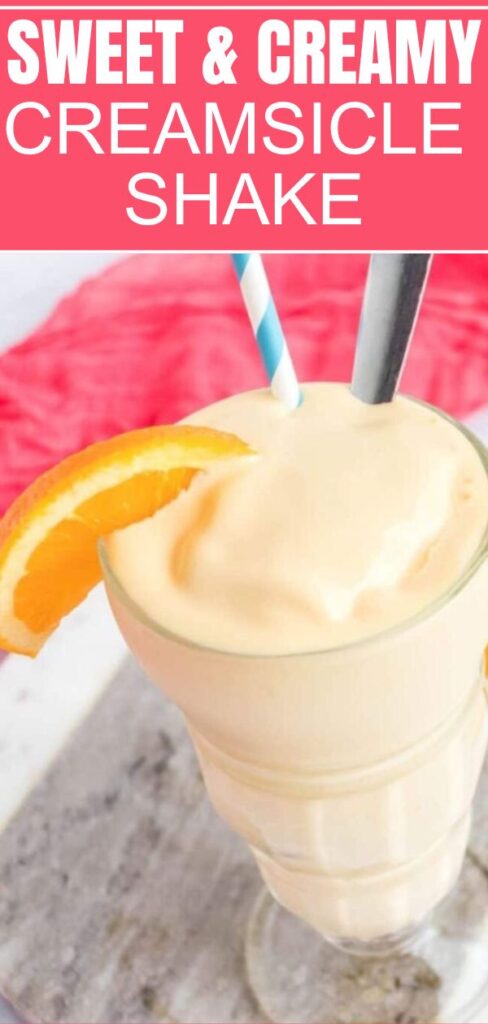 Creamsicle Shake in a glass with straw and spoon inside glass 