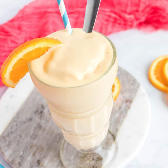 clear cup with an orange shake