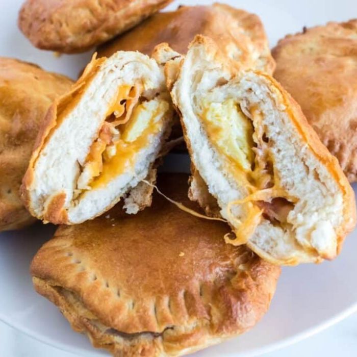 Air Fryer Breakfast Bombs on a plate with one cut in half to show the filling 
