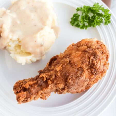 Fried Chicken Leg on plate with mashed potatoes