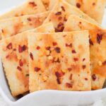 Alabama Heat Crackers in a white bowl with a white background on table