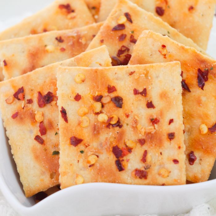 Alabama Heat Crackers in a white bowl with a white background on table