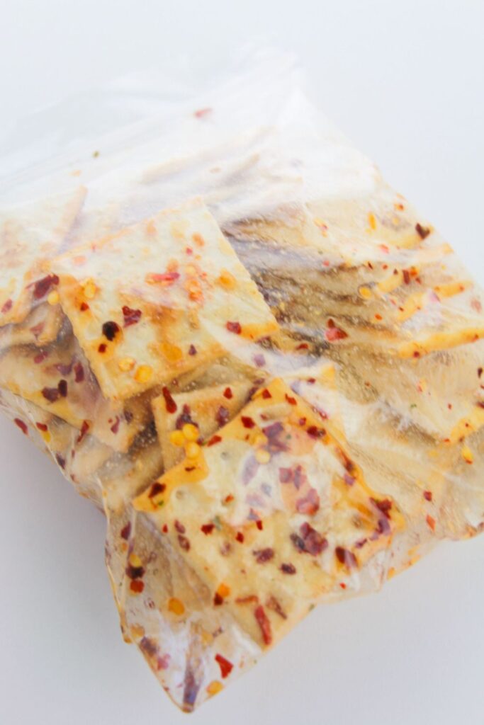 a Ziploc bag full of Alabama Heat Crackers sitting on a white table