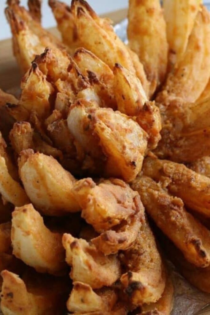 close up of an air fried blooming onion that is nice and crispy and battered