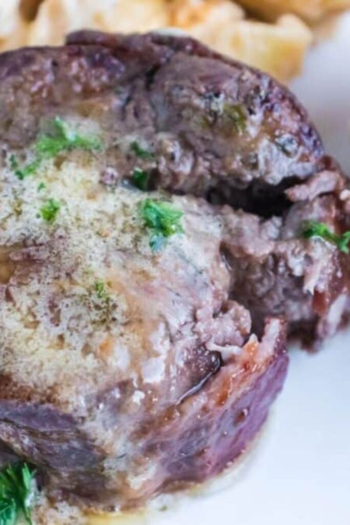 garlic butter topped filet mignon steak